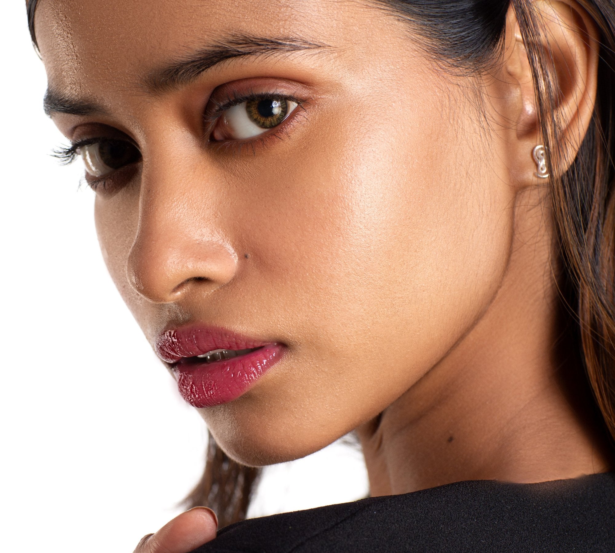 Gloss Balm in shade Love Notes on dusky skin tone